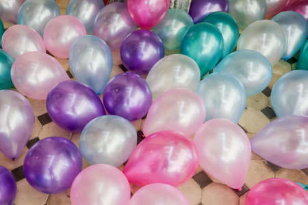Different color balloons on the floorの写真素材