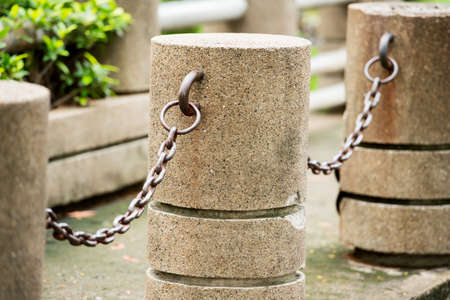 cement pole and chainの写真素材
