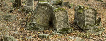 Valley of Josaphat in Crimea. Karaite cemetery. Tombstones. Shaped tombstones are diverse:...