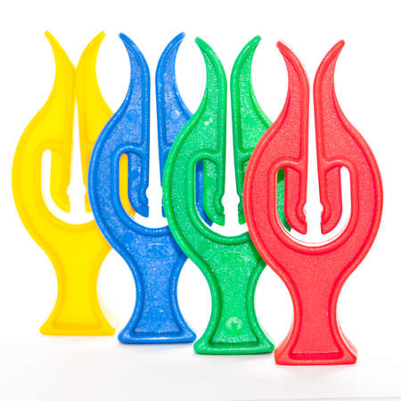 A small collection of colourful clothes pegs.の写真素材