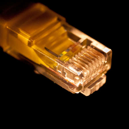 A cat-5 connector shot against a black background.