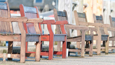 A row of empty benches at the marina.のeditorial素材