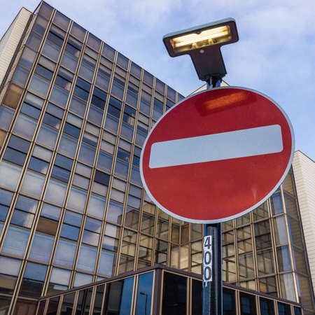 A red no entry sign situated outside an office building in Southampton, Hampshire, UK のeditorial素材