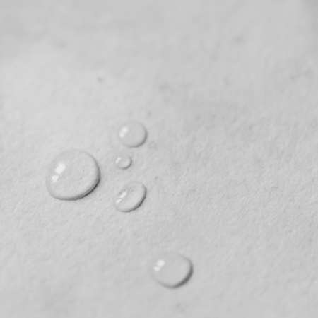 A few drops of water on a counter top の写真素材
