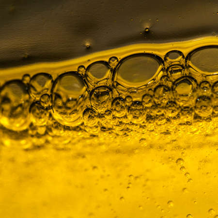An abstract shot of bubbles forming in some liquid detergent の写真素材