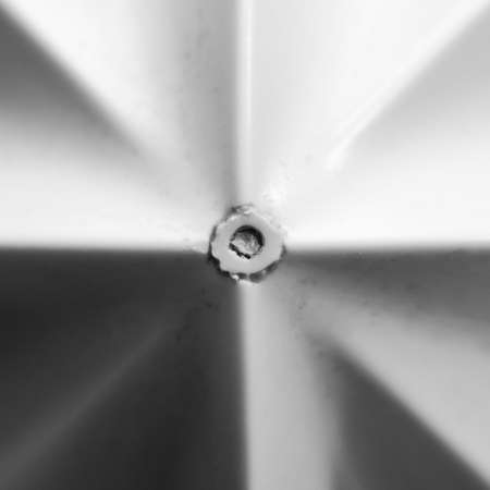 A macro shot of the pattern made by the top of a juicer 