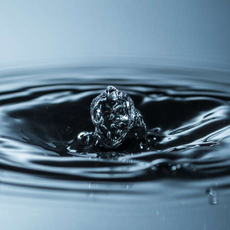 An abstract shot of water dropping into a pool の写真素材