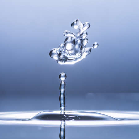 An abstract macro shot of a water drop collision の写真素材
