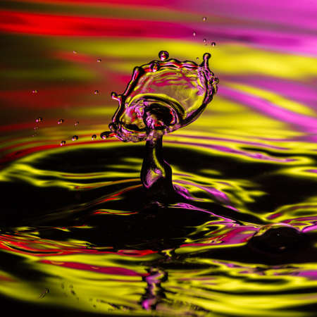 An abstract macro shot of a water drop collision.の写真素材
