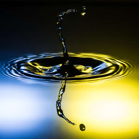 An abstract macro shot of a water drop splash.の写真素材