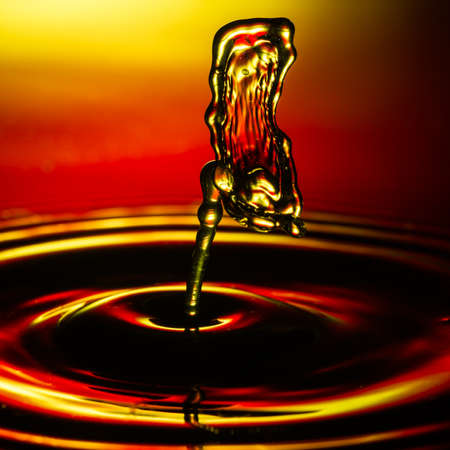 An abstract macro shot of a water drop collision.の写真素材