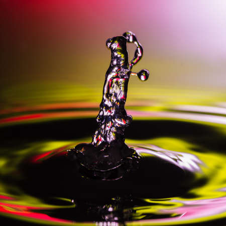 An abstract macro shot of a water drop collision.の写真素材