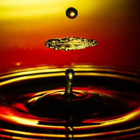An abstract macro shot of a water drop collision.の写真素材