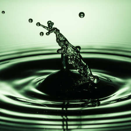 An abstract macro shot of a water drop collision.の写真素材