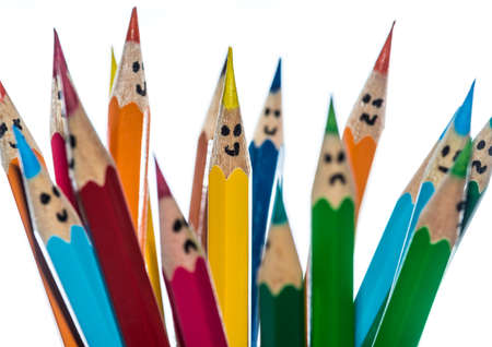 A macro shot of some coloured pencils with faces drawn on them.の写真素材