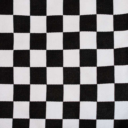 An abstract macro shot of the black and white pattern of some oven gloves.