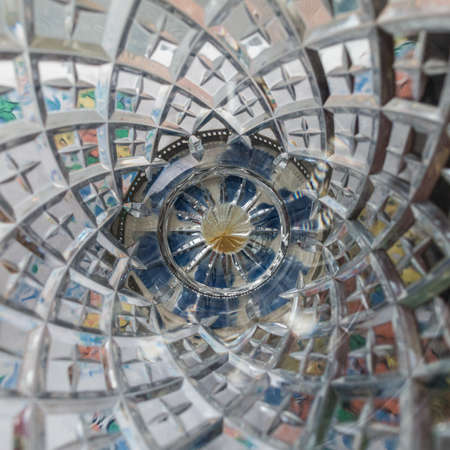 An abstract macro shot of the inside of a cut crystal vase.