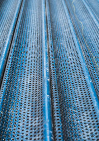 An abstract macro shot of a shop window shutter.の写真素材