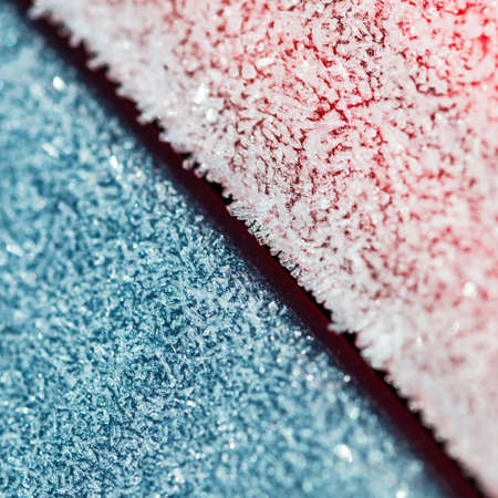 A shot of the frost covered surfaces of a car.