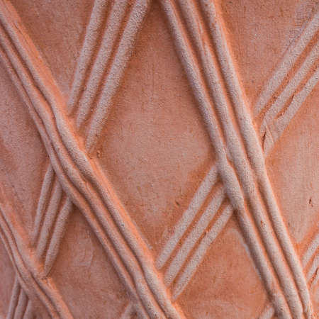 An abstract macro shot of the texture of the side of a terracotta pot.の写真素材