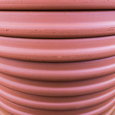An abstract macro shot of the texture of the side of a terracotta pot.の写真素材