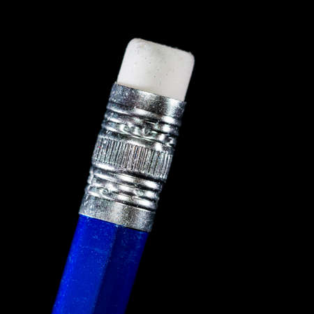 A macro shot of a pencil eraser shot against a black background.の写真素材