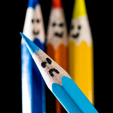 A fun macro shot of some coloured pencils with faces.の写真素材