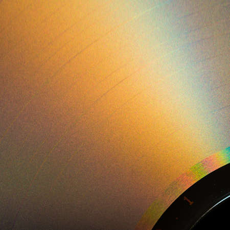 Sunlight plays across the surface of a compact disc.の写真素材