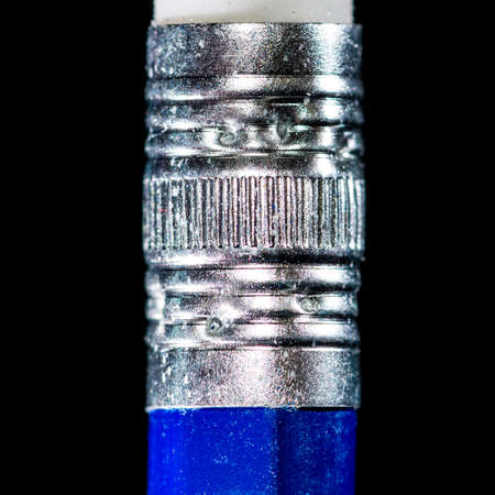 A macro shot of a pencil eraser holder shot against a black background.の写真素材