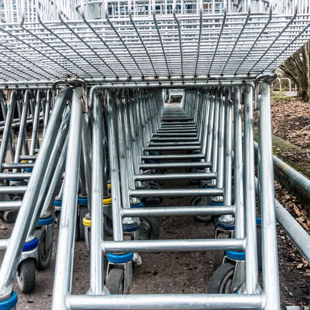 A shot of the tunnel made by a stack of shopping trolleys.の写真素材