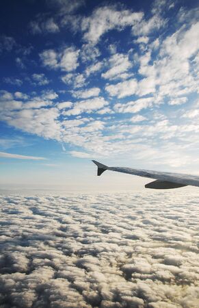 Aerial shot of a cloudscape view from the plane at sunset time - surreal cloudscape - fantasy dreamy...