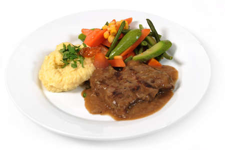 Grilled steaks, mashed potato and vegetable saladの写真素材