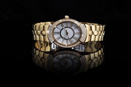 fancy diamond hand watch isolated on black reflective backgroundの写真素材