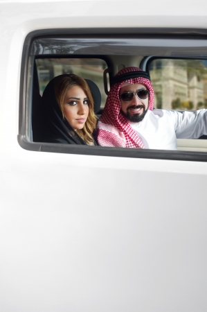 Arabian Couple in their car in the city の写真素材