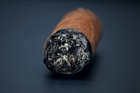 Closeup of a cigar on black backgroundの写真素材