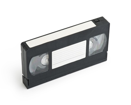 Old video cassette tape isolated with a blank tag 