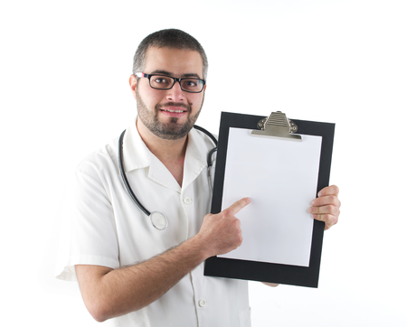Male doctor holding a clipboard isolatedの写真素材
