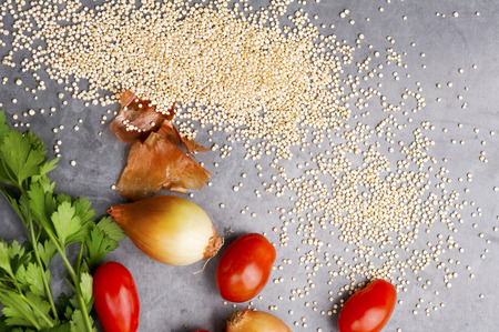 Close up of quinoa grains cherry tomato, onion and parsleyの写真素材