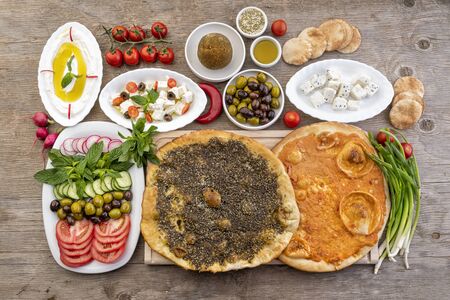 Lebanese food of Manakish, Lbaneh, cheeses, Vegetables and olivesの写真素材