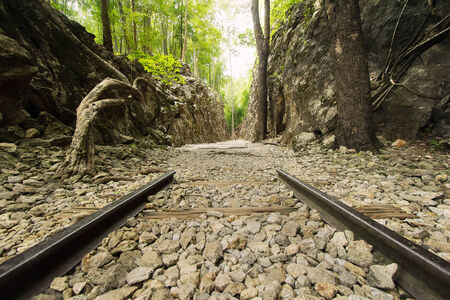 Kanchanaburi, Thailand - Jun 27, 2014  Old iron rail set in historic area as a symbolic のeditorial素材