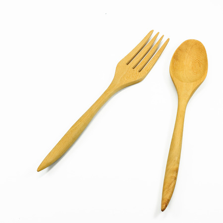 Wooden spoon and fork isolated on white backgroundの写真素材