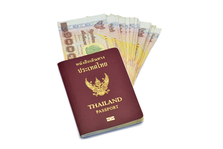 Thailand passport with banknote on white backgroundの写真素材