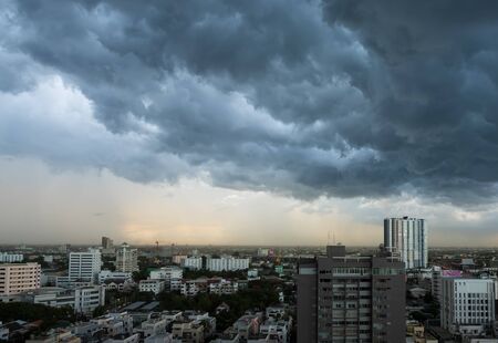 A sky background with dark clouds of storm in rainy season.の写真素材