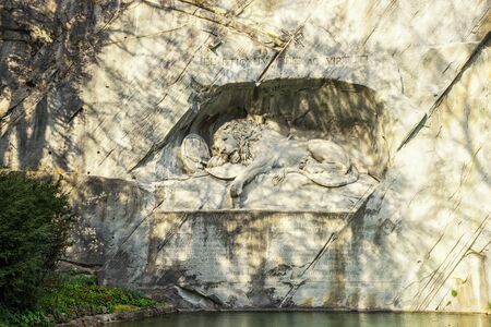 Lucerne, Switzerland - April 11, 2016 : The famous place for tourist in Lucerne 'Dying Lion Wall Monument', a rock relief built for commemorates to the Swiss Guards who were massacred in 1792 during the French Revolution.のeditorial素材