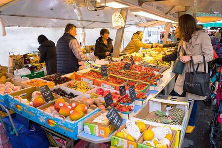 Geneva, Switzerland - April 16, 2016 : People chose for a  fresh fruit at street market in Geneve, Switzerlandのeditorial素材
