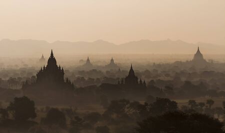 Silhouettes of old temples before sunrise in Bagan, Myanmarの写真素材