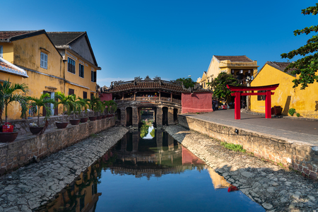 Hoi An, Vietnam - October 7, 2019 : Tourists visiting the ancient Japanese covered bridge, a famous place in Hoi An, world heritage city in Vietnam.のeditorial素材