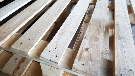 wooden pallets overlap in warehouseの写真素材