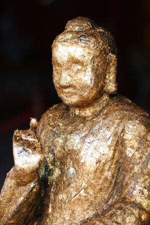 Chinese Buddha statue filled with gold leafの写真素材