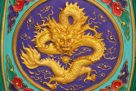 close-up golden dragon marble carving wall, Decorative Chinese art style at Chinese public templeの写真素材
